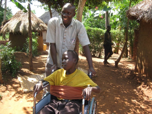 Oliver in a wheelchair smiling